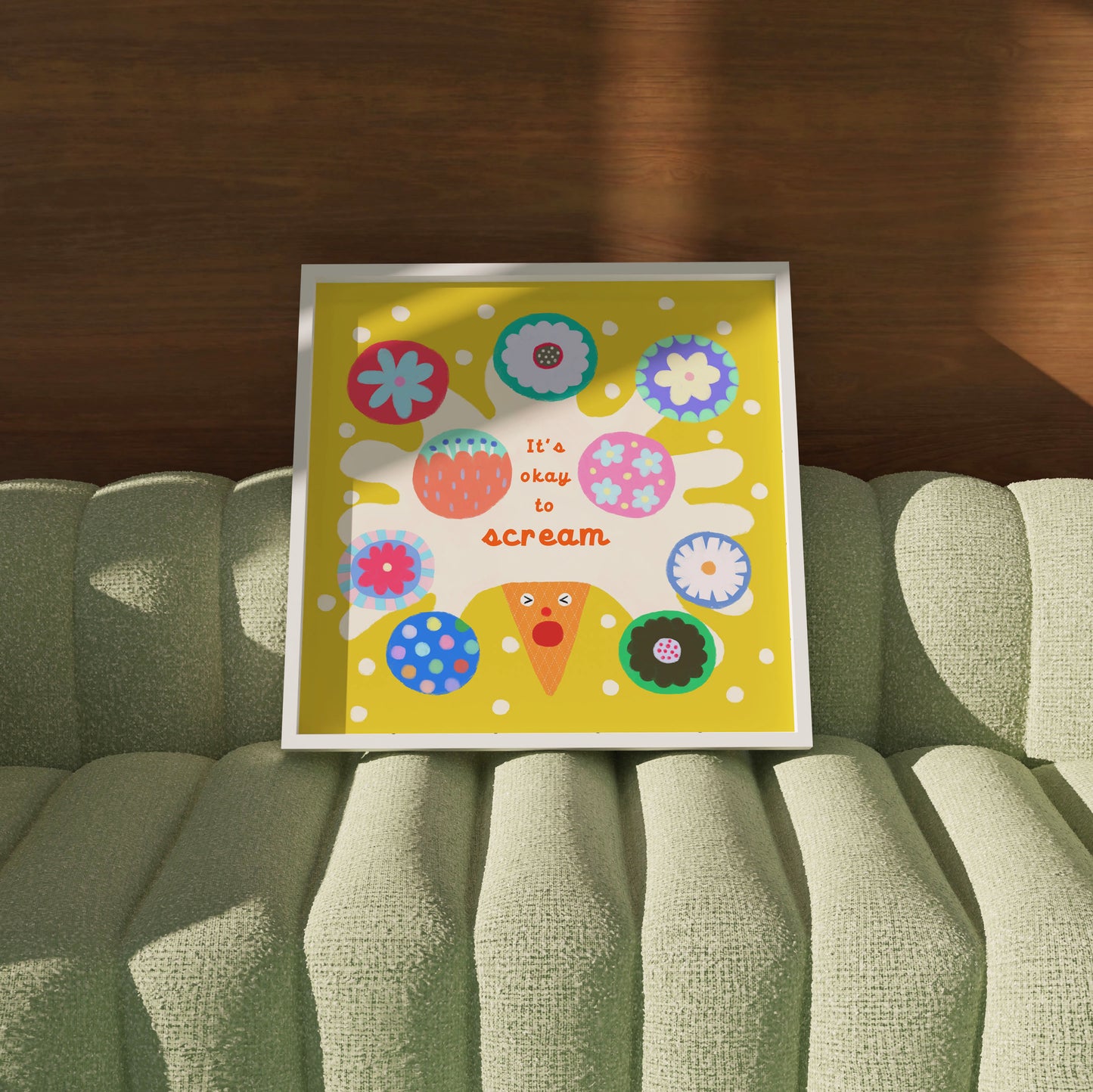‘It’s Okay to Scream’ haPPy scOOp Poster by Biliboo Shop, propped on a sofa in a contemporary setting.