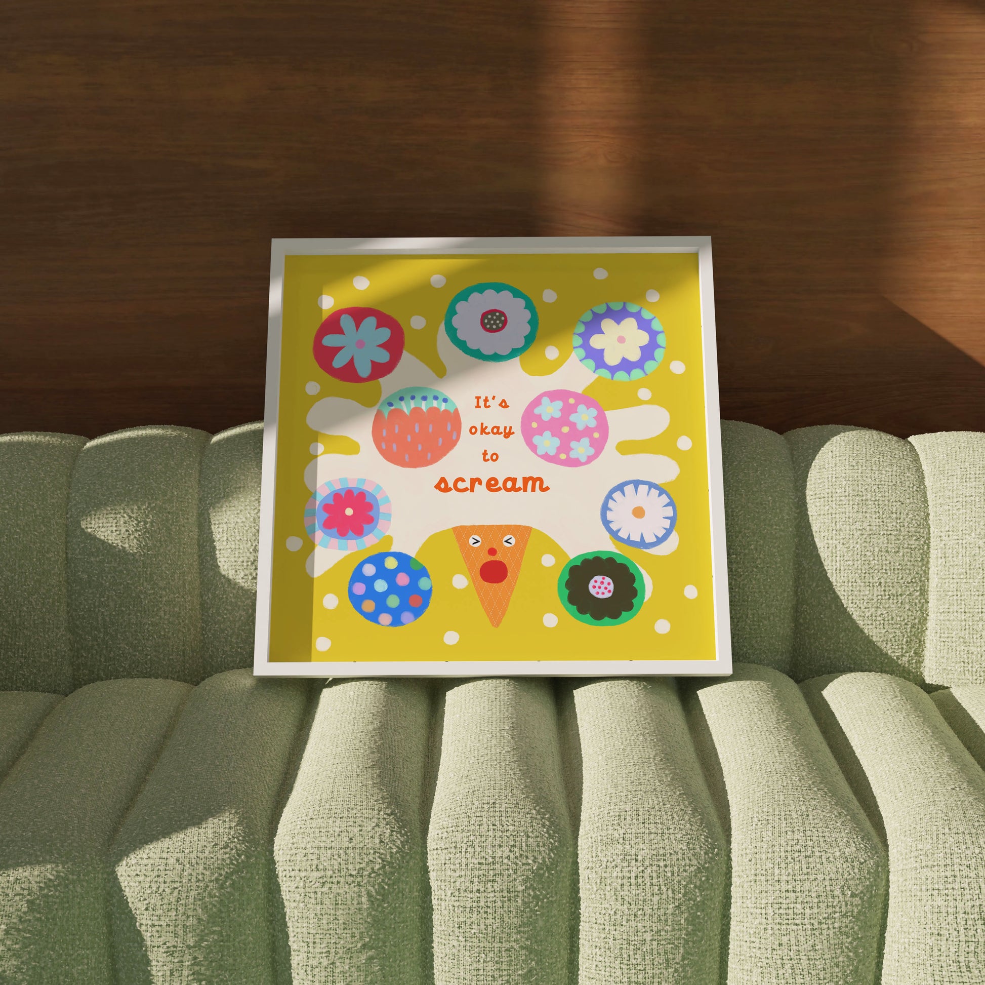 ‘It’s Okay to Scream’ haPPy scOOp Poster by Biliboo Shop, propped on a sofa in a contemporary setting.