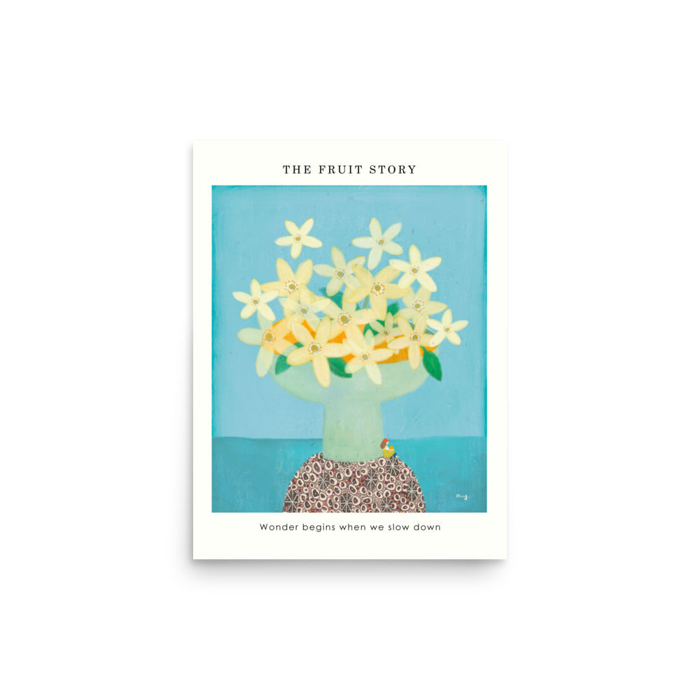 Orange Poster from The Fruit Story showing pale yellow orange blossoms in a light green vase on a patterned table, with the printed message “Wonder begins when we slow down.”