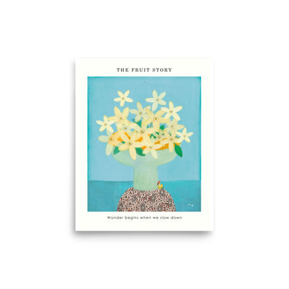 Orange Poster from The Fruit Story showing pale yellow orange blossoms in a light green vase on a patterned table, with the printed message “Wonder begins when we slow down.”