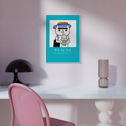 Sip by Sip – cozy cat illustration from the Malo Collection, shown as wall art displayed in a modern living room setting